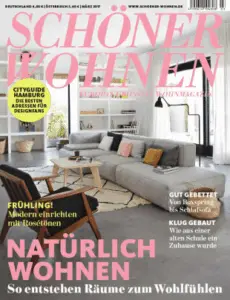 Cover der Zeitschrift „Schöner Wohnen“ mit einem modernen Wohnzimmer, hellen Möbeln und einer gemütlichen Atmosphäre.