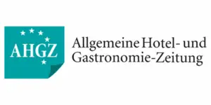Logo der Allgemeinen Hotel- und Gastronomie-Zeitung (AHGZ) mit Text und Sterne-Elementen in turquoise und schwarz.